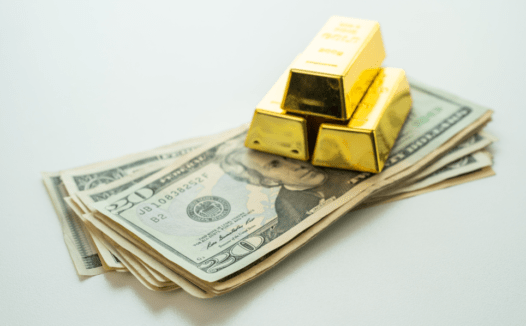 Gold bars and US currency